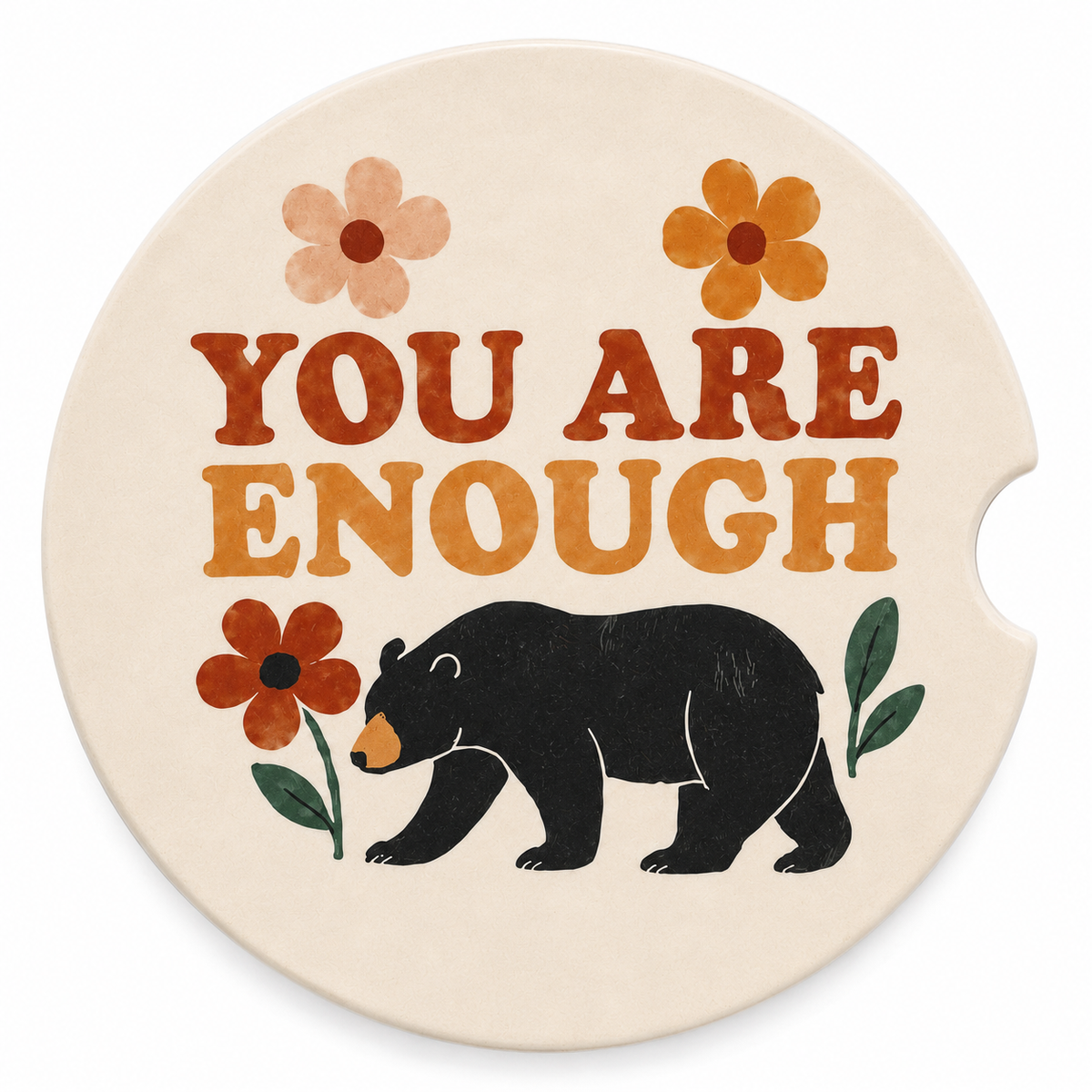 Close-up of You Are Enough ceramic car coaster with black bear and colorful wildflower design on white background
