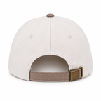 Back view of He Is Risen Baseball Cap in Ash Mocha showing cream cotton back panels with two ventilation eyelets, mocha top button, and mocha adjustable back strap with antique brass slide buckle closure on white background
