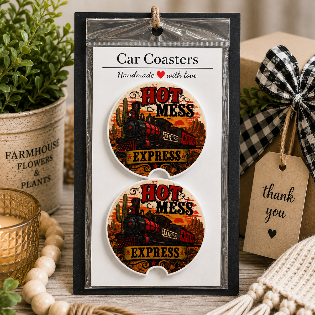 Hot Mess Express (Train) Car Coaster Set in handmade packaging — gift-ready ceramic coasters with vintage steam train and desert sunset design, displayed with kraft gift box and buffalo check bow, set of 2

