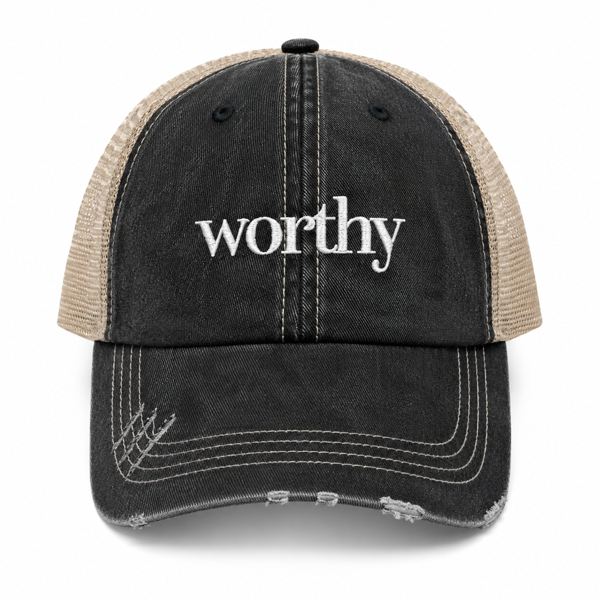 A distressed trucker cap with a washed black front panel and brim, beige mesh back panels, and white embroidered text reading 'worthy' on the front, shown against a plain white background.