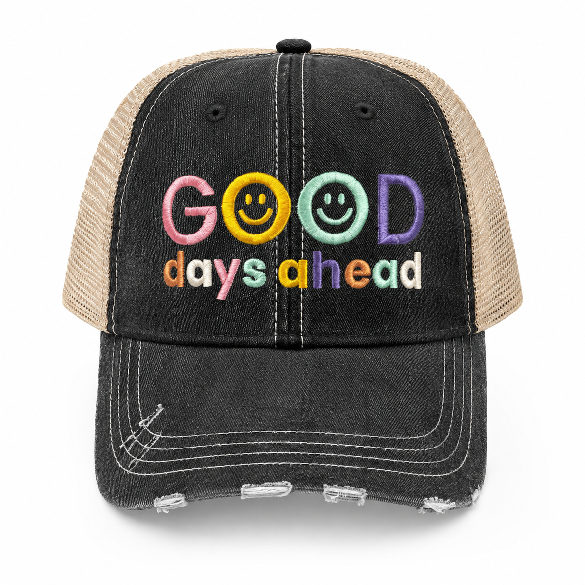 A distressed trucker hat with a black washed denim front panel and beige mesh back. The front features colorful embroidered text reading 'GOOD days ahead' with smiley faces inside the letters.