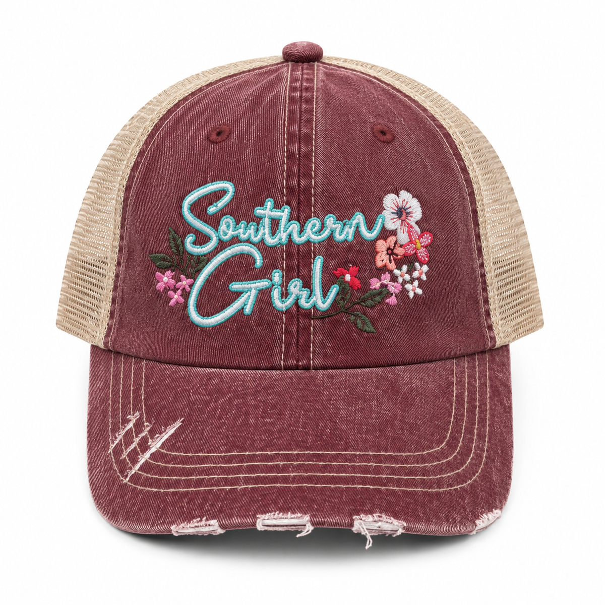 A distressed trucker cap in washed burgundy and beige mesh, featuring 'Southern Girl' embroidered in light blue script with pink and white flowers on the front panel.