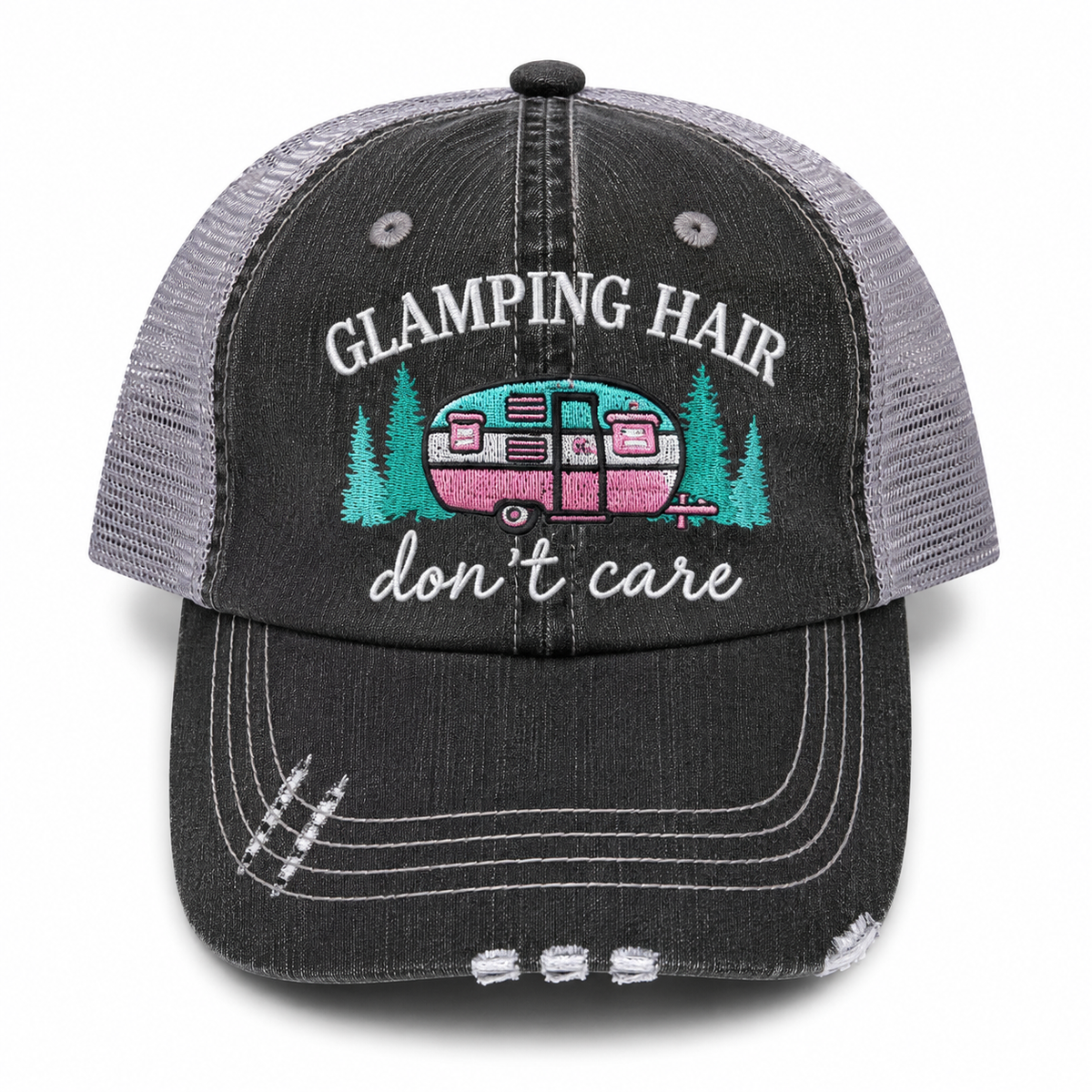 Glamping Hair Don't Care trucker hat in distressed black denim front with embroidered camper scene in teal and pink, shown on a white background.
