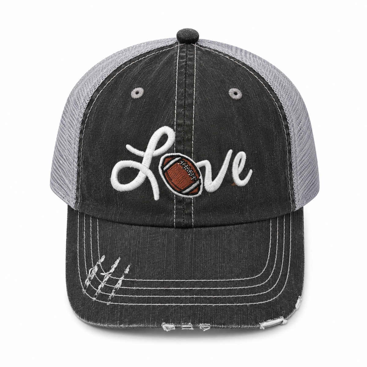A distressed trucker-style baseball cap with a dark gray washed front panel and brim, light gray mesh back panels, and white embroidered script reading 'Love' with a football motif in the letter 'o'.
