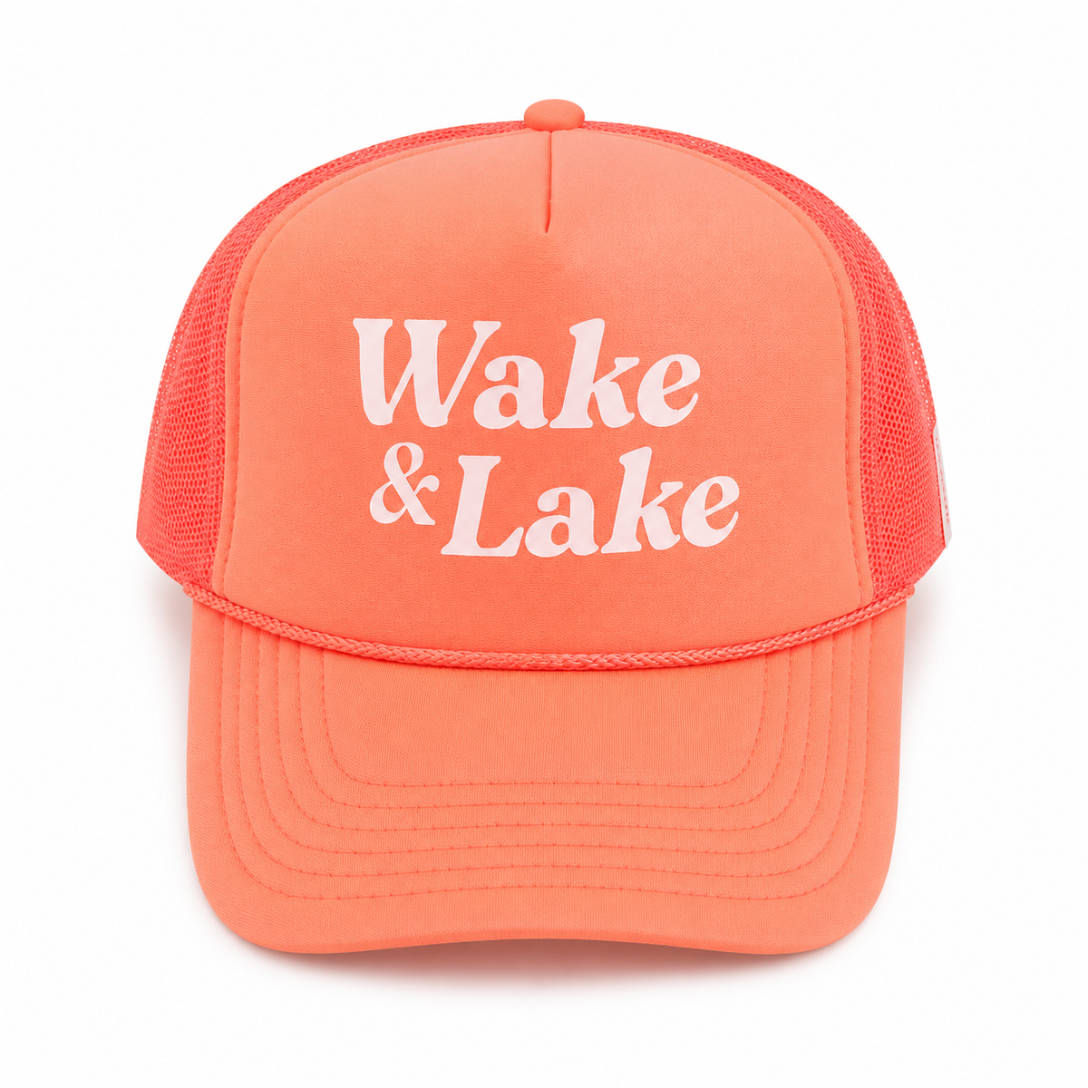 Wake & Lake Trucker Hat in coral-orange foam front with white retro printed lettering and coral mesh back, shown on a white background.

