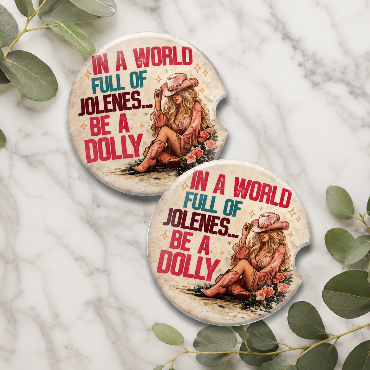 In a World Full of Jolenes Be a Dolly Car Coaster Set — set of 2 ceramic coasters with retro cowgirl in pink hat and boots, roses, and bold pink and teal lettering on cream
