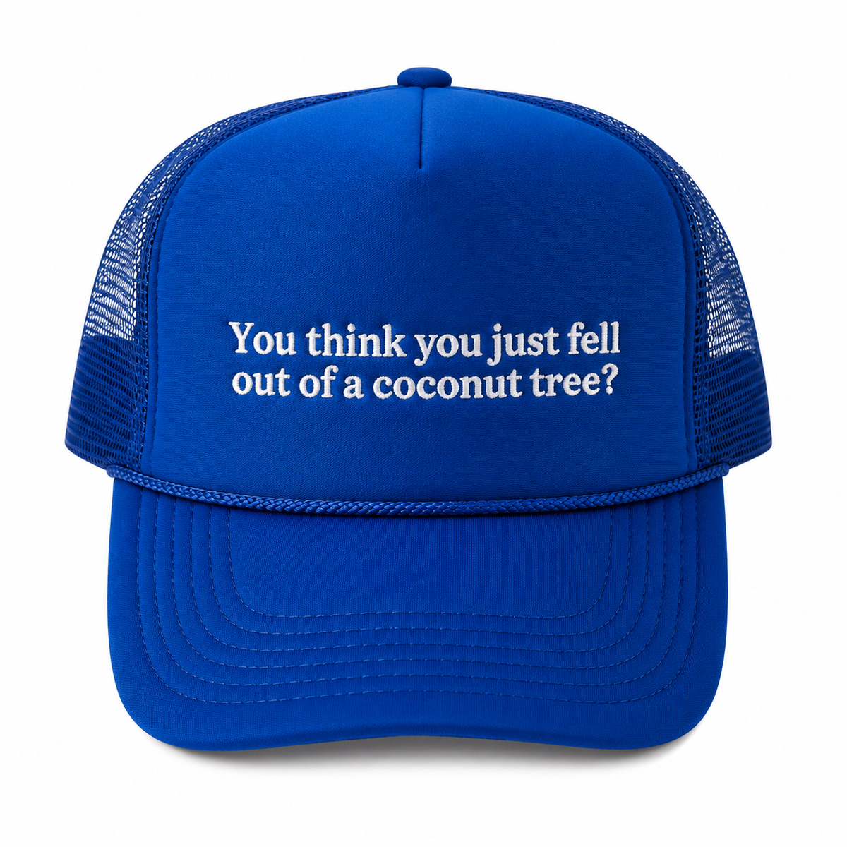 Coconut Tree Trucker Hat in royal blue with white embroidered "You think you just fell out of a coconut tree?" quote, rope accent along the brim, and blue mesh back, shown on a white background.
