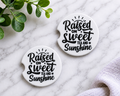 Raised on Sweet Tea and Sunshine car coasters with bold black script on white background