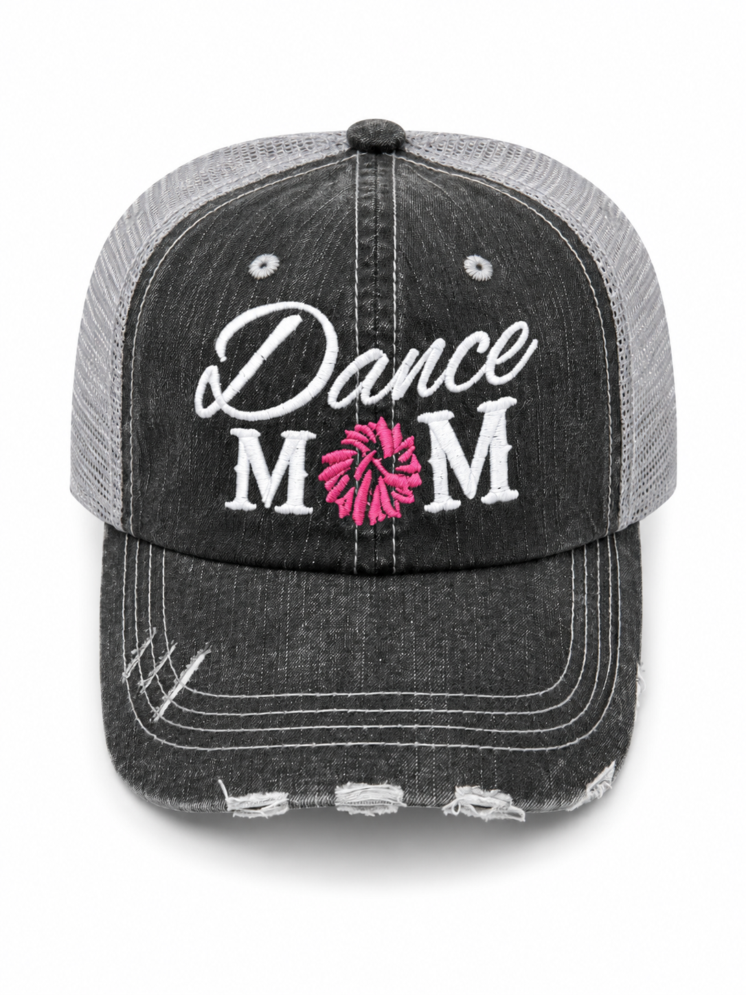 Dance Mom trucker hat in distressed black denim front with white script embroidery and pink pom-pom detail, shown on a white background.
